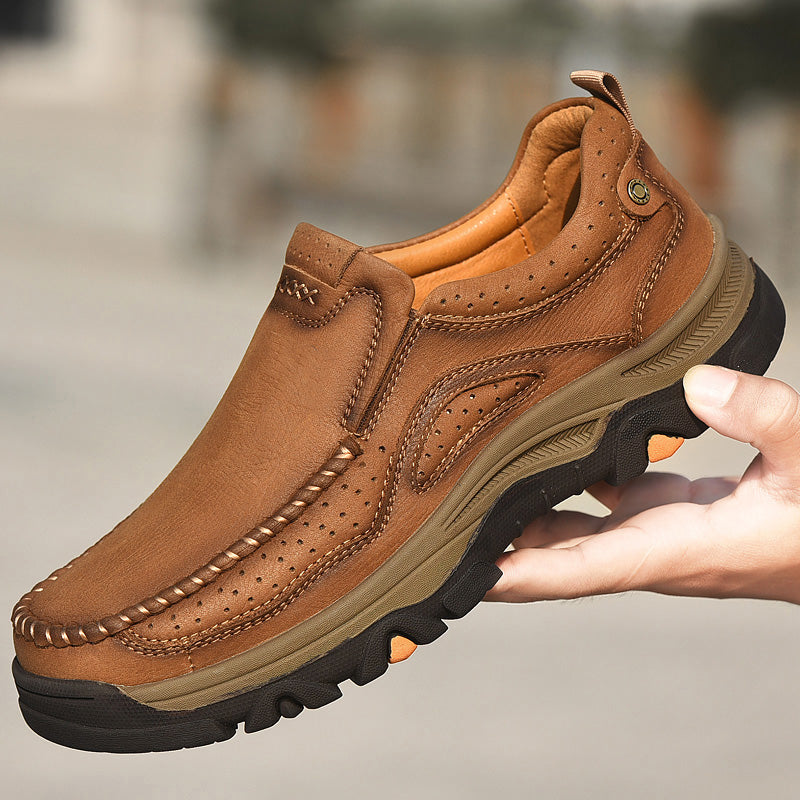 Close-up of the slip-resistant sole on a black Unisex Orthopedic Transition Boot, durable tread.