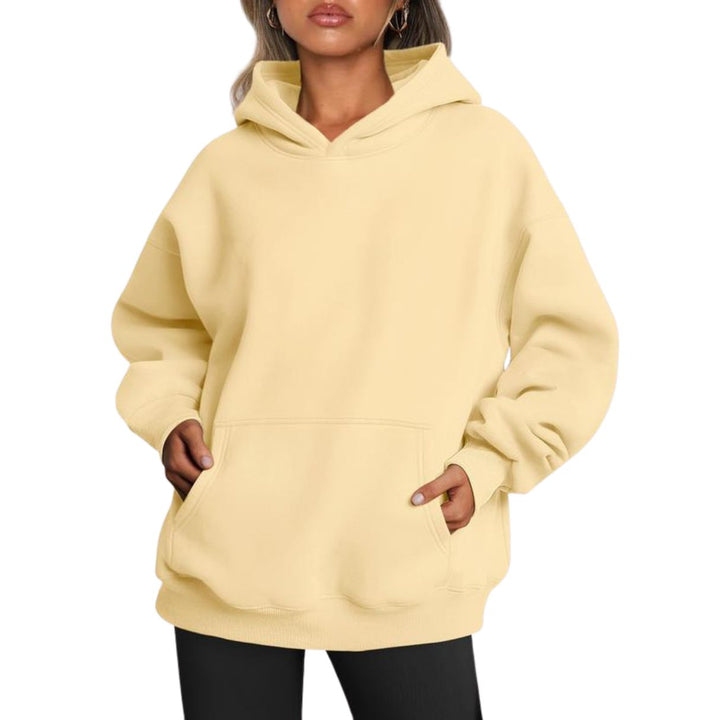 Model wearing an oversized unisex hoodie, perfect for a relaxed streetwear look, made from a soft cotton blend