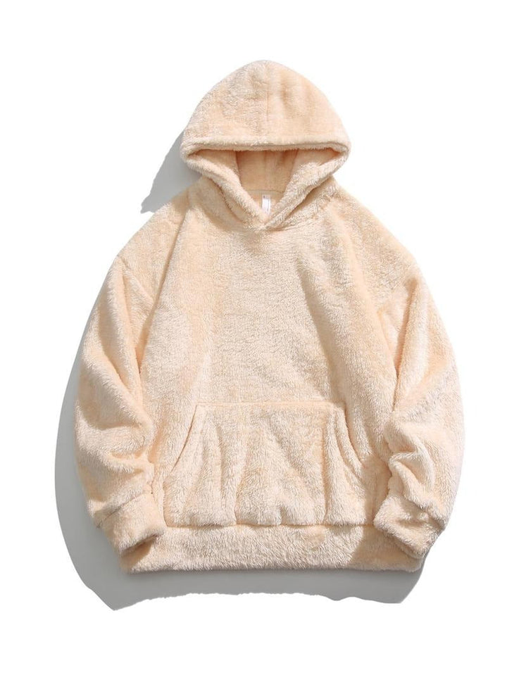 Model wearing a cozy unisex faux fur fleece hoodie, showcasing its plush texture and relaxed fit.