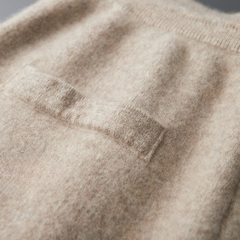 Side view of model wearing relaxed fit merino wool lounge joggers, showcasing elastic waist