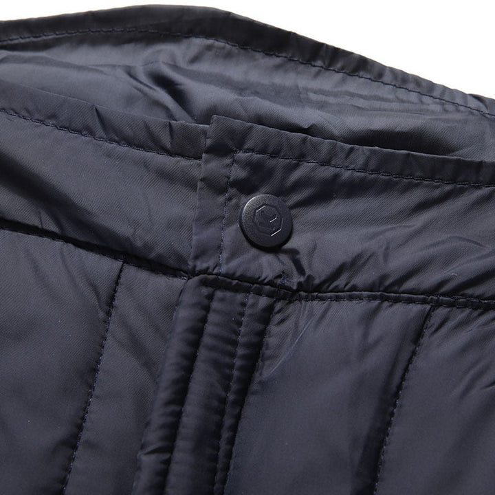 Model wearing black unisex thermal duck down pants, showcasing fit and windproof design for winter.