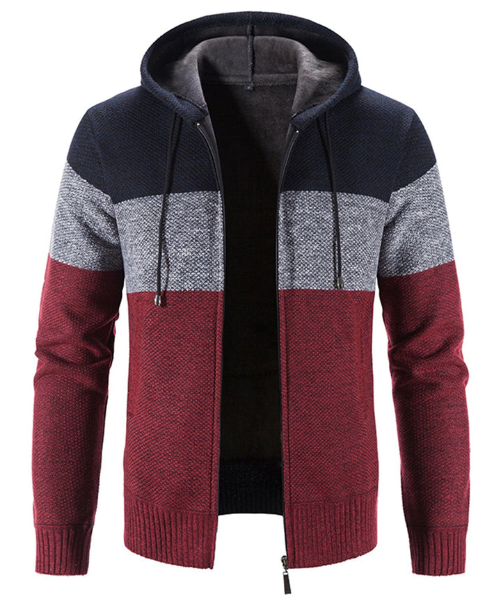 Detailed shot of the hood and drawstrings on a tri-tone knit performance hoodie, emphasizing quality.