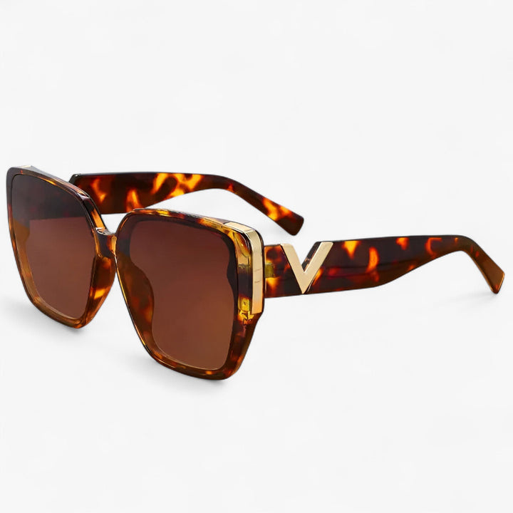 Trendy unisex V-shaped mirrored sunglasses, ideal for a bold, statement look.