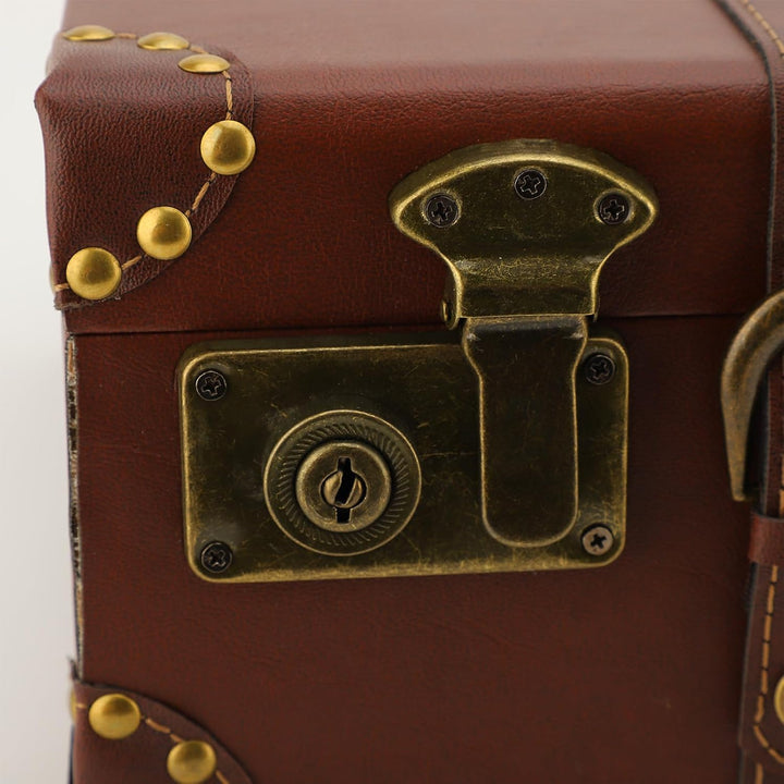 Durable unisex vintage leather travel trunk with secure lock. A classic carry-on case for any journey.