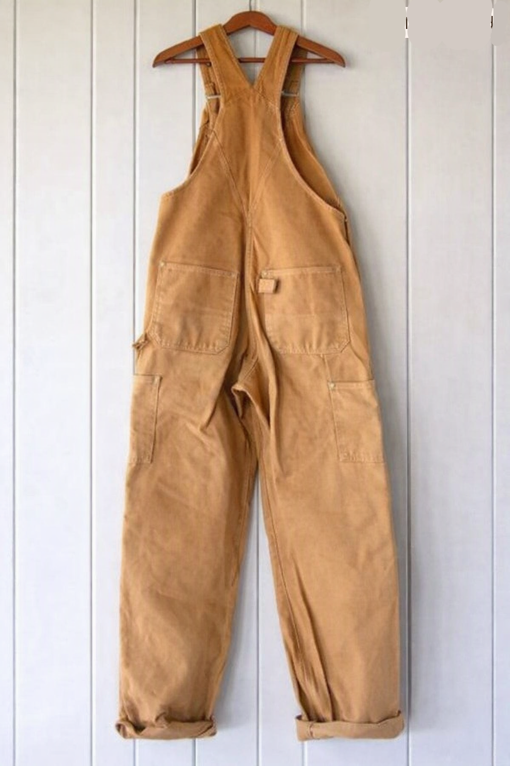Unisex vintage-style bib overalls offering a relaxed, comfortable fit with adjustable straps for versatile everyday fashion.
