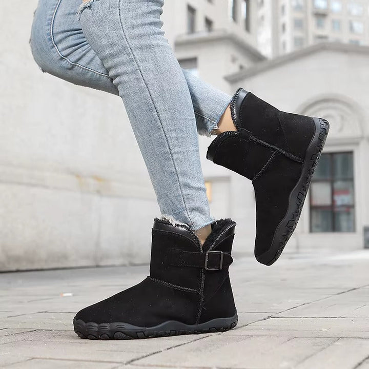 Warm, all-gender barefoot boots, comfortable and flexible for winter outdoor adventures.