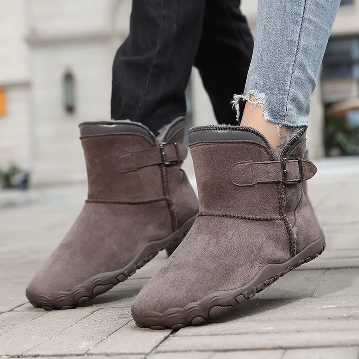 Flexible barefoot winter boots for cold weather, unisex design with roomy toe box.