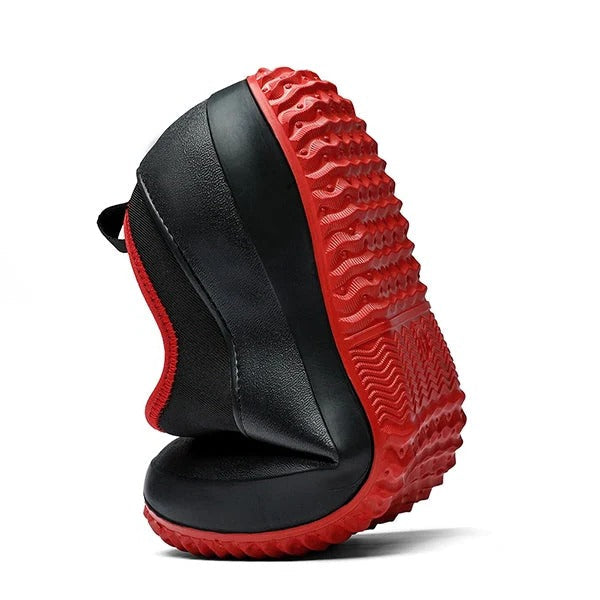 Close-up of black unisex waterproof slip-on work shoes, showcasing non-slip sole and comfortable design.