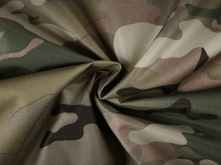 Unisex rain jacket with removable hood in an outdoor setting, suggesting its use in adverse weather