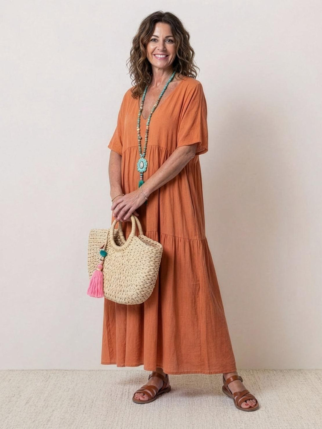 Women's Boho V-neck tiered maxi dress, flowy & elegant. Perfect for summer beachwear.