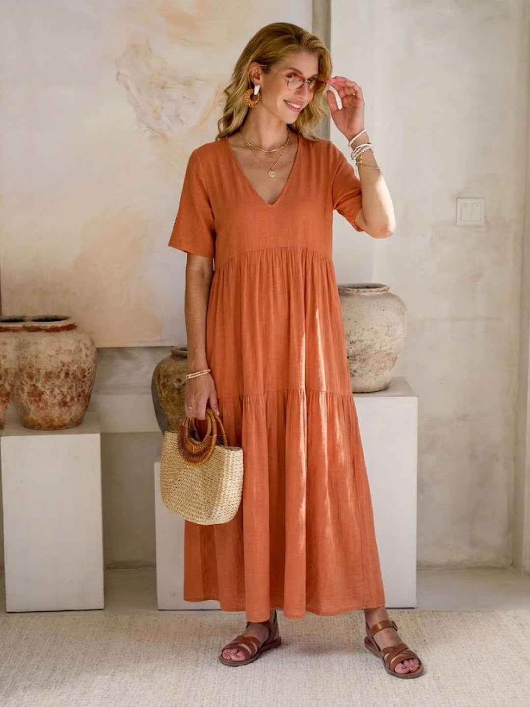 Chic women's bohemian long dress with V-neck, tiered skirt. Ideal for resort & vacation.
