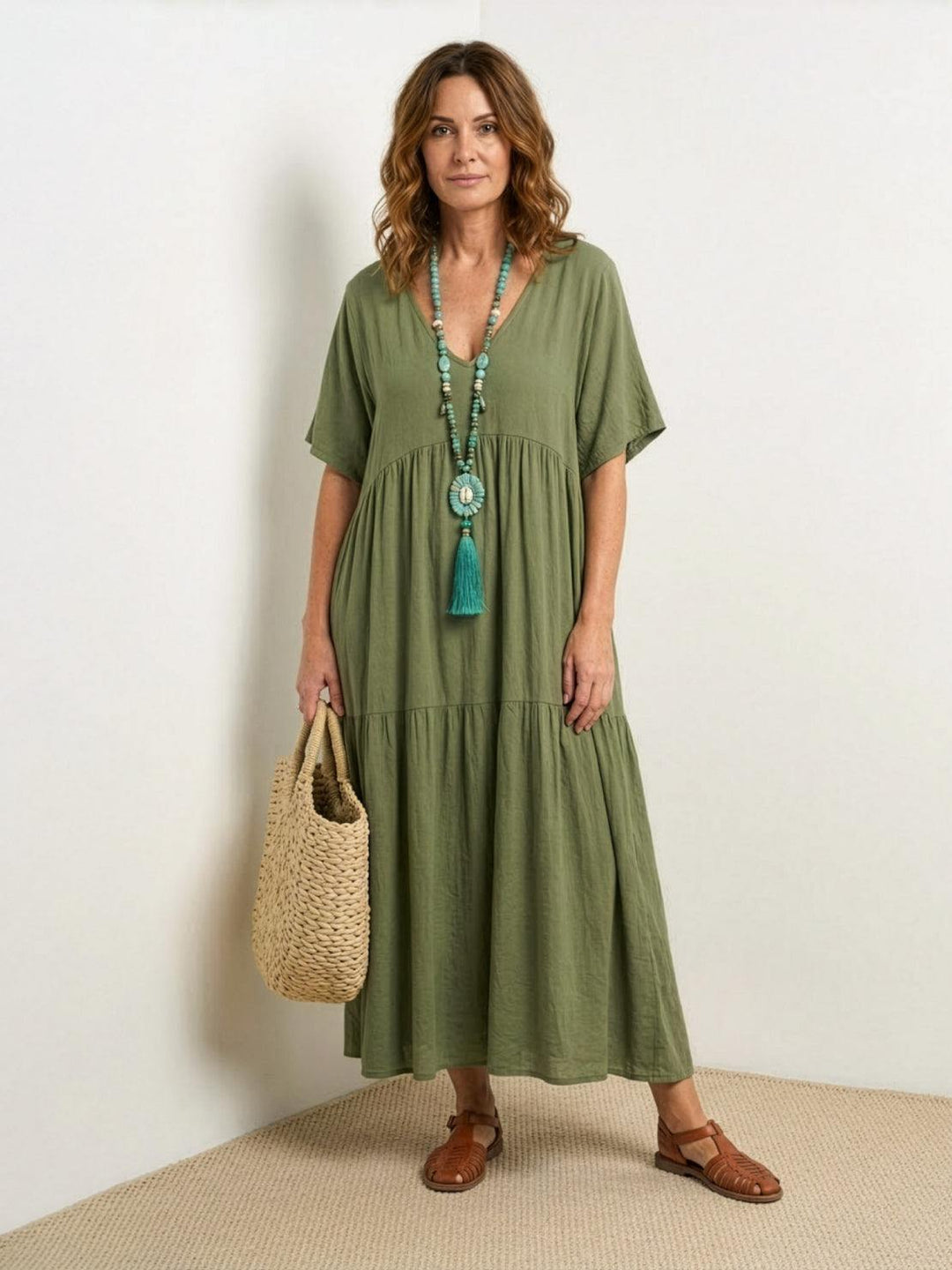 Bohemian women's tiered flowy V-neck gown, a long summer dress for ultimate comfort.