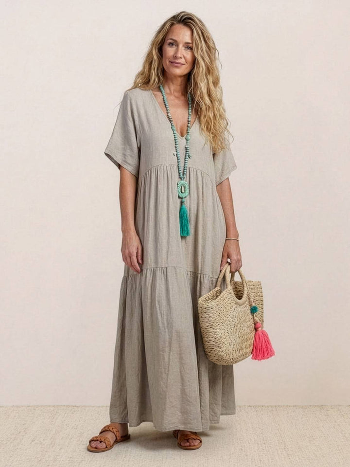 Summer women's V-neck tiered flowy gown, a beautiful bohemian beach dress.
