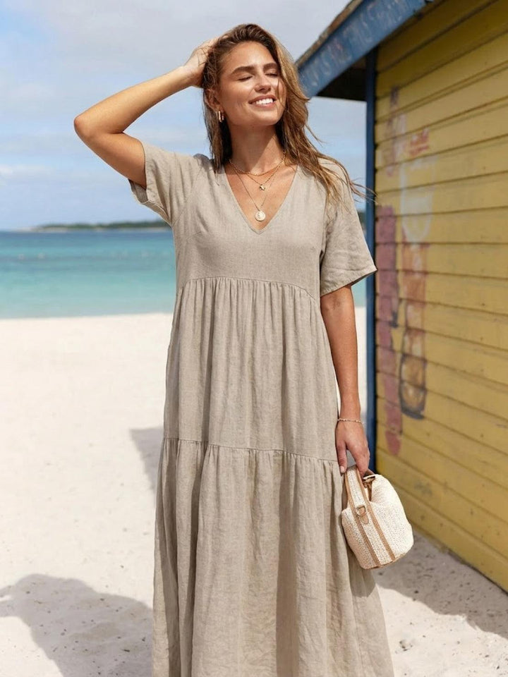 Women's long tiered V-neck boho dress, perfect for relaxed elegant summer evenings.