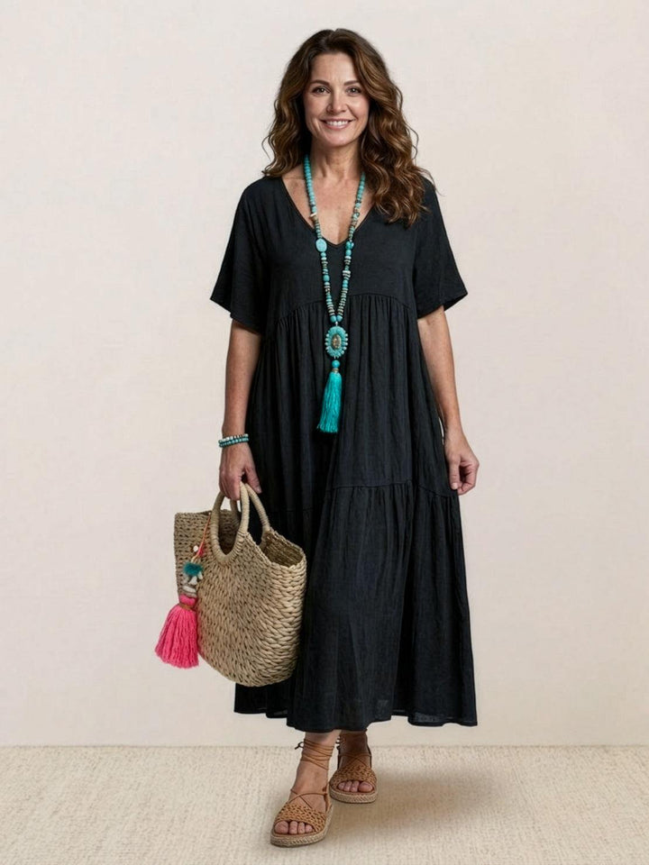 Women's elegant boho maxi dress with V-neck, tiered skirt, perfect for resort or party.