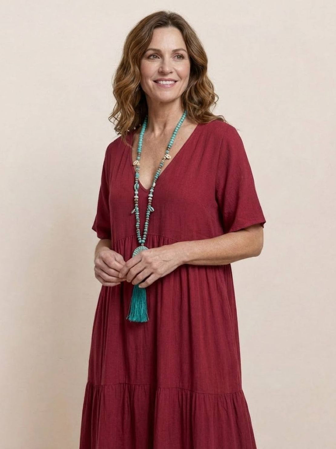 Women's versatile boho V-neck maxi dress, tiered & flowy, suitable for many occasions.