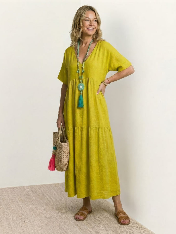 Women's comfortable V-neck tiered maxi dress, flowy bohemian style for relaxation.