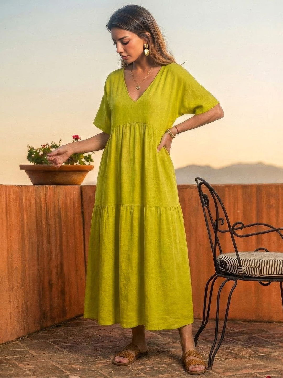 Stylish women's V-neck tiered flowy maxi dress, perfect as a resort or beach cover-up.