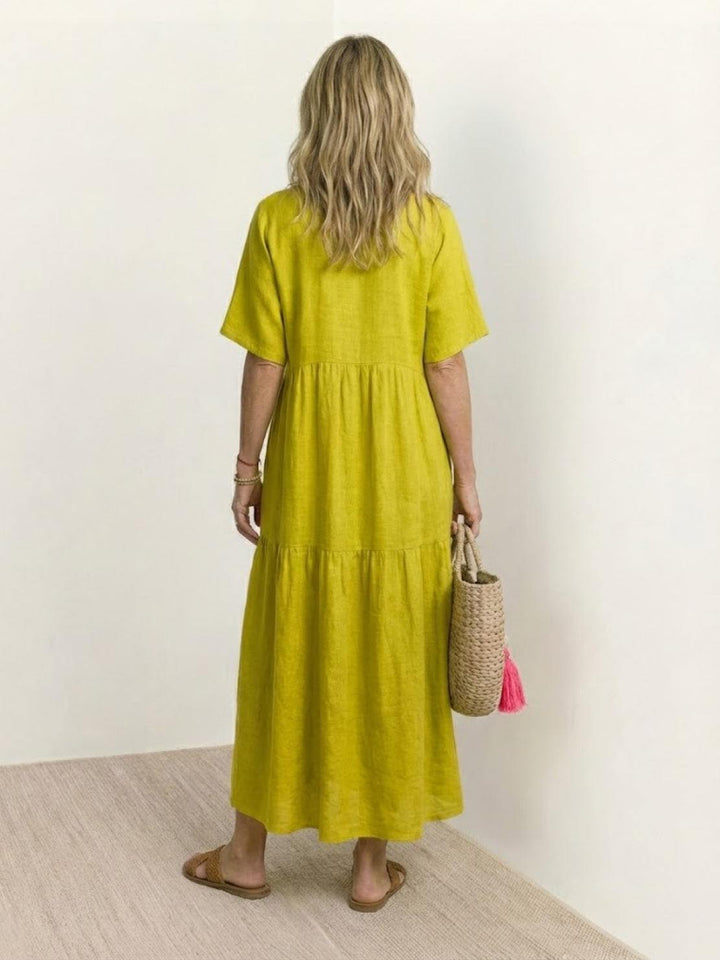 Elegant V-neck tiered maxi dress for women, bohemian flowy silhouette for sunny days.