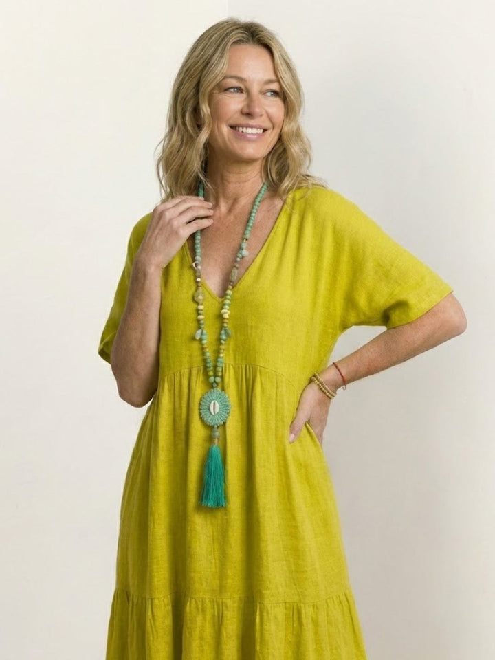 Women's casual boho V-neck tiered maxi dress, flowy fabric, perfect for a relaxed look.