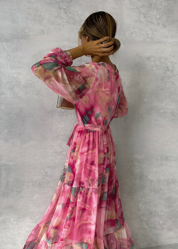 Women's elegant floral wrap maxi dress with V-neck, ruffled sleeves, and tiered skirt, ideal for weddings.