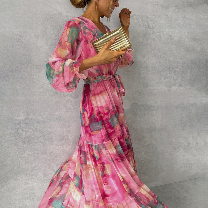 Women's vibrant floral print wrap maxi dress, featuring a flowy tiered skirt and V-neck, great for elegance.