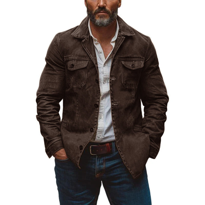 Stylish man wearing a rugged vintage work jacket, ideal for casual mid-season fashion.