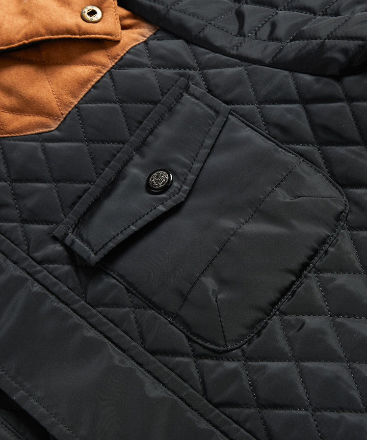 Folded black men's insulated sherpa-lined winter jacket, showcasing its compact yet warm design