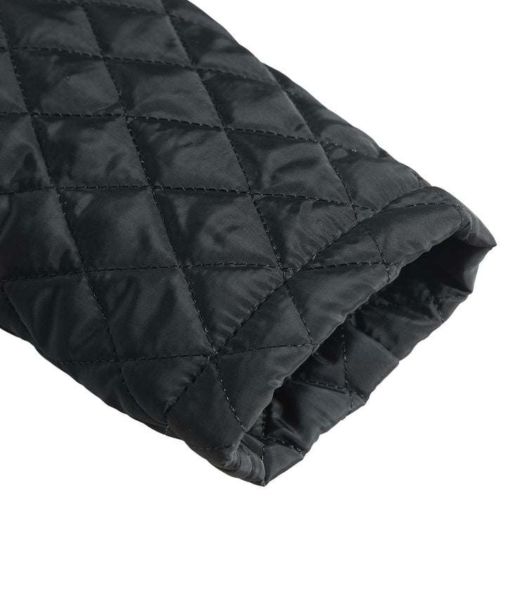 Close-up of the durable fabric on a black men's insulated winter jacket, built for rugged use