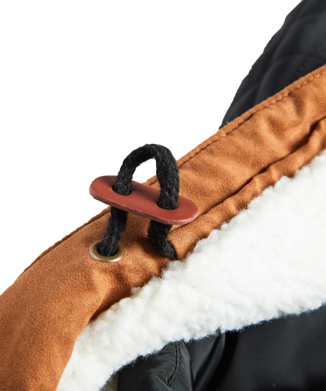Detail of the cuffed sleeve on a men's black sherpa-lined winter jacket, showing quality insulation