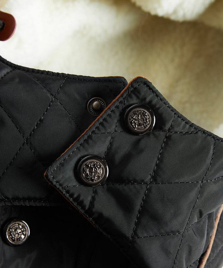 Black insulated men's winter jacket with sherpa collar, providing extra warmth and a stylish look