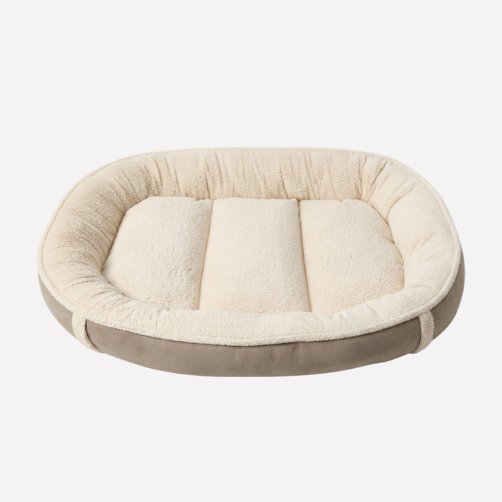 Cozy washable pet nest bed. Plush comfort for dogs, featuring a removable cover & non-slip design.