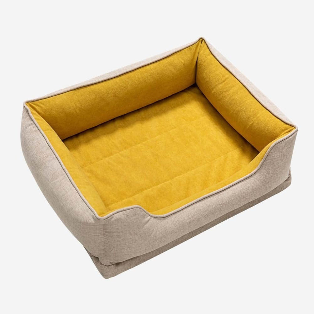 Soft, durable bolster cat bed with non-slip base. Washable pet bed offers ultimate comfort for lounging felines.