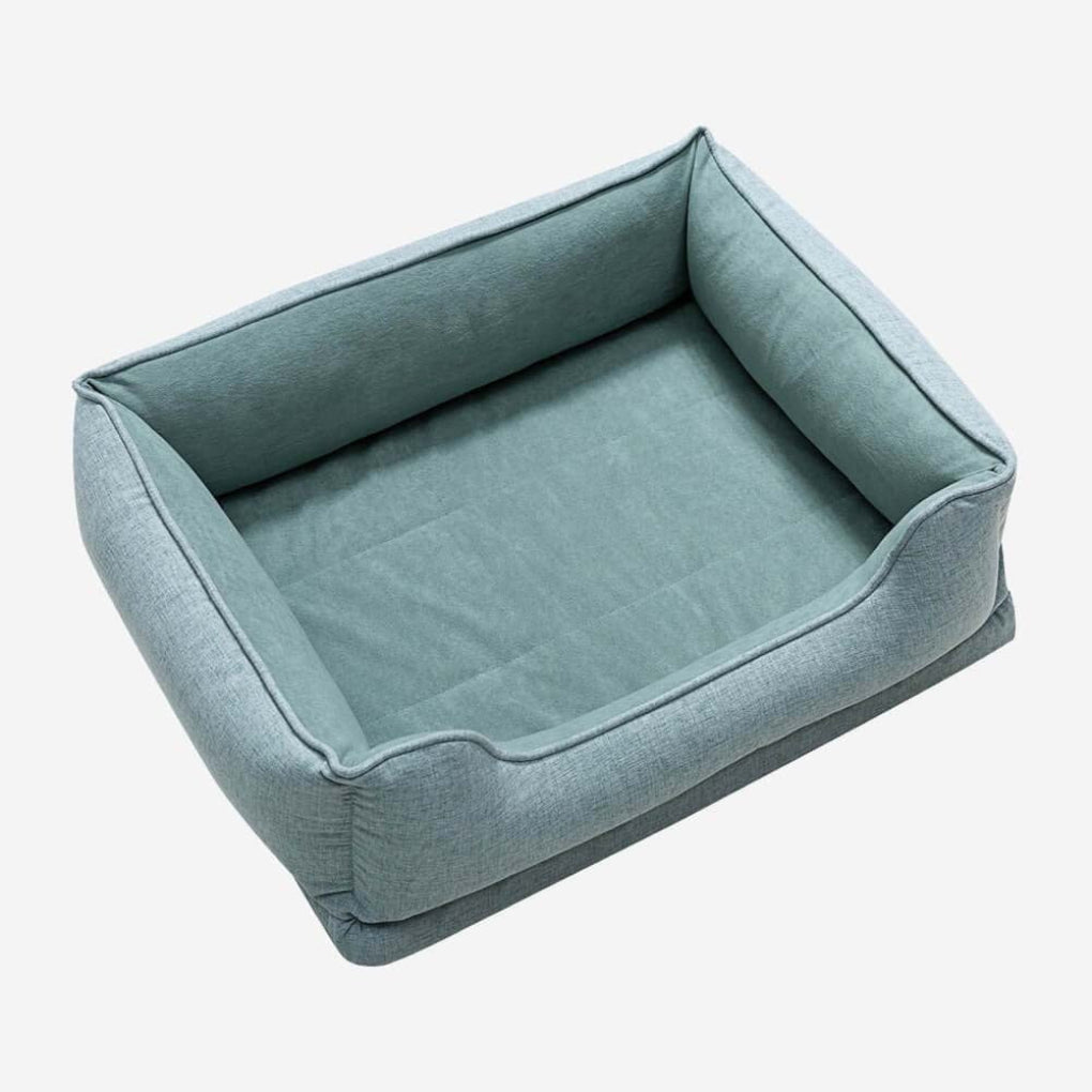 Easy-care washable cat bed with a non-slip base & bolster design. Provides ultimate comfort for lounging pets.
