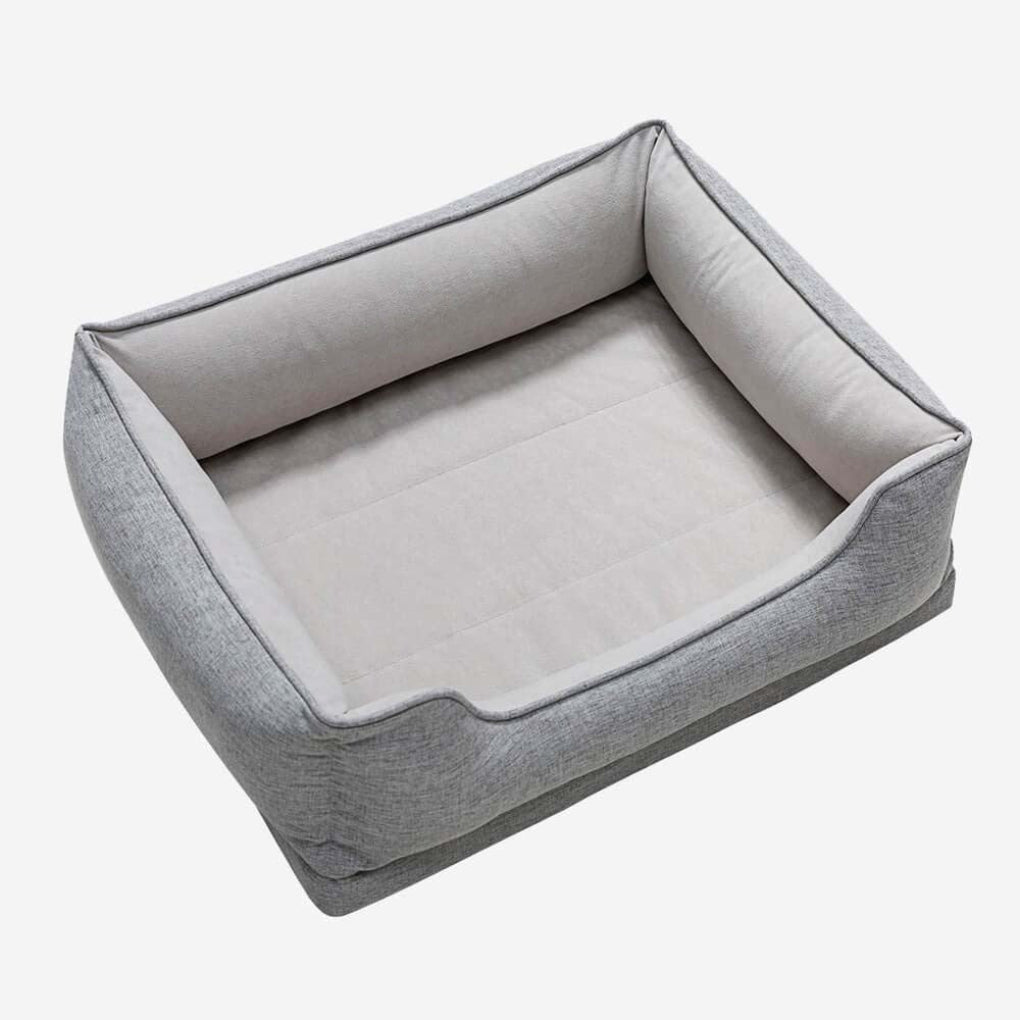 Comfortable washable pet bed for cats. Features a soft bolster & non-slip design for cozy feline sleep & lounging.