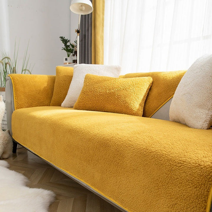 Premium thick fleece sofa cover, waterproof & non-slip, offering cozy comfort and ultimate furniture protection.