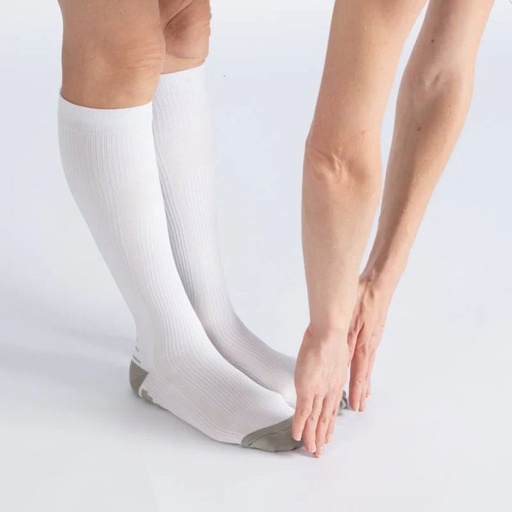 Unisex gentle compression socks in white & gray, showing soft fabric for comfort