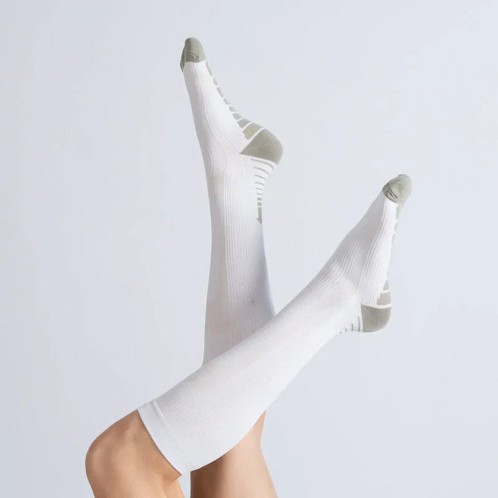 Athletic white & gray compression socks, unisex design, providing gentle support