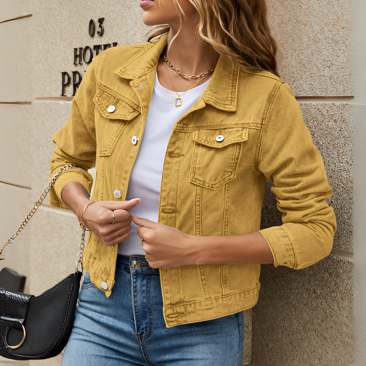 Front view of a woman in a well-fitted classic button down jacket, suitable spring/summer outerwear.