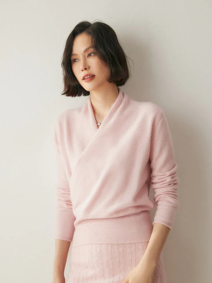 Luxurious pink cashmere crossover sweater, perfect for cold weather
