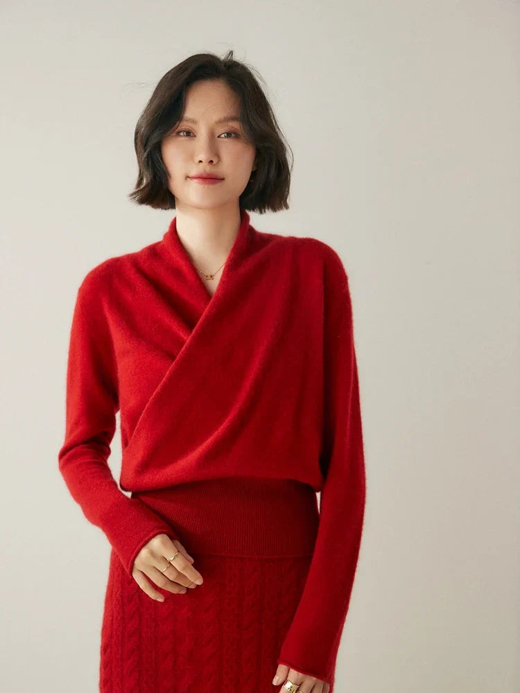 Detail of the fine knit on a red cashmere crossover sweater, quality