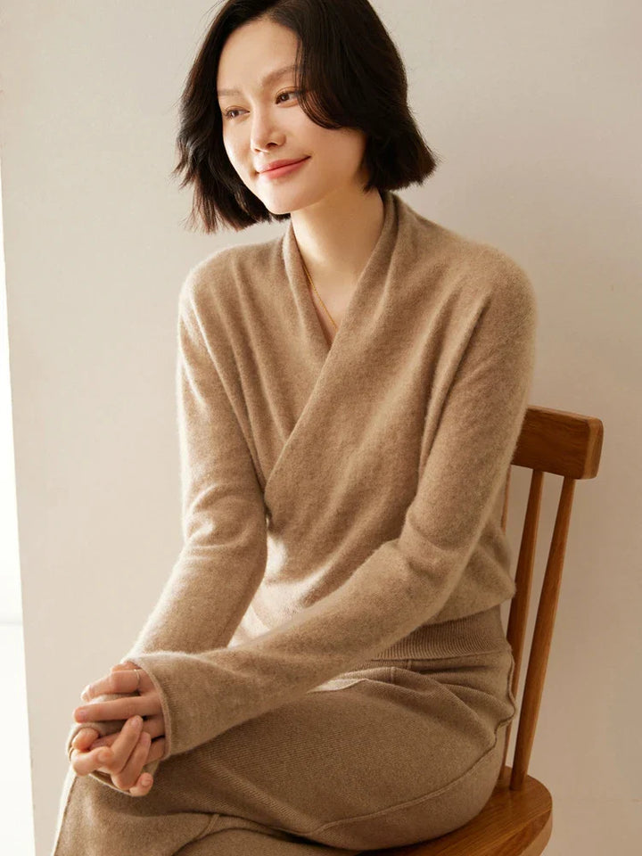 Full shot of a luxurious ivory women's cashmere crossover sweater
