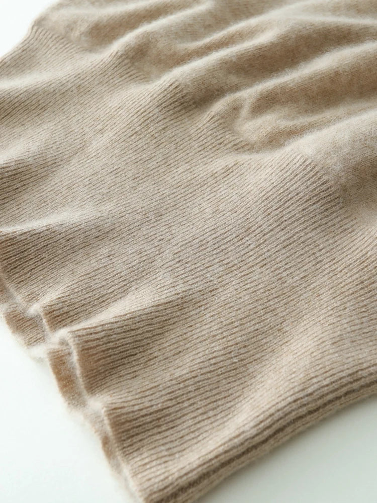 Back view of a woman in a camel cashmere crossover sweater, chic look