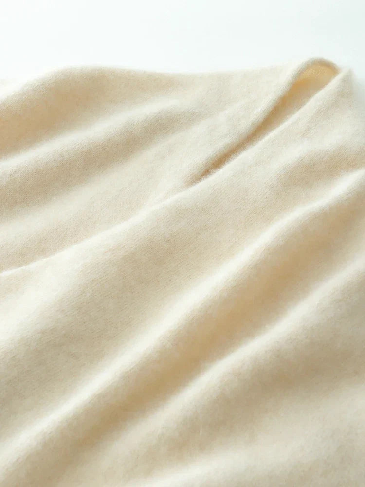 Detail of the knit pattern on a camel cashmere crossover sweater