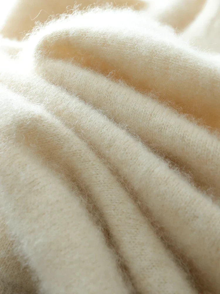 Full shot of a luxurious beige women's cashmere crossover sweater