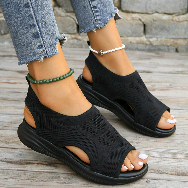 Modern women's orthopedic walking sandals, featuring adjustable straps & cushioned sole.