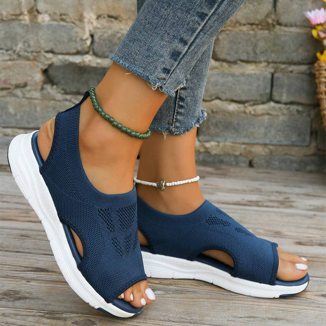 Women's walking sandals with hook-and-loop adjustable straps & contoured footbed.