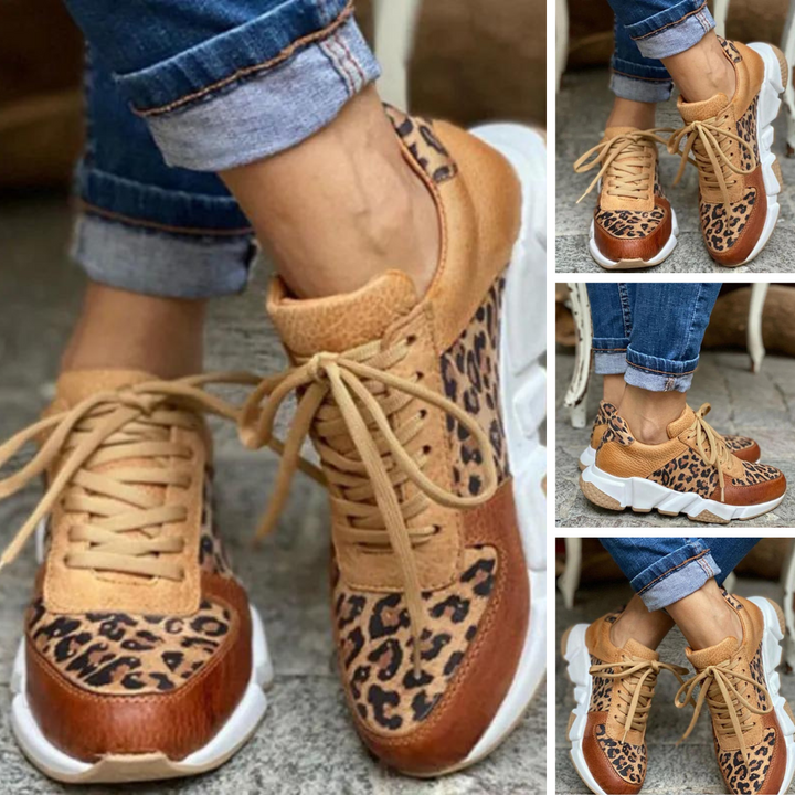Side view of a women's animal print lace-up sneaker, showcasing details and athletic fashion.
