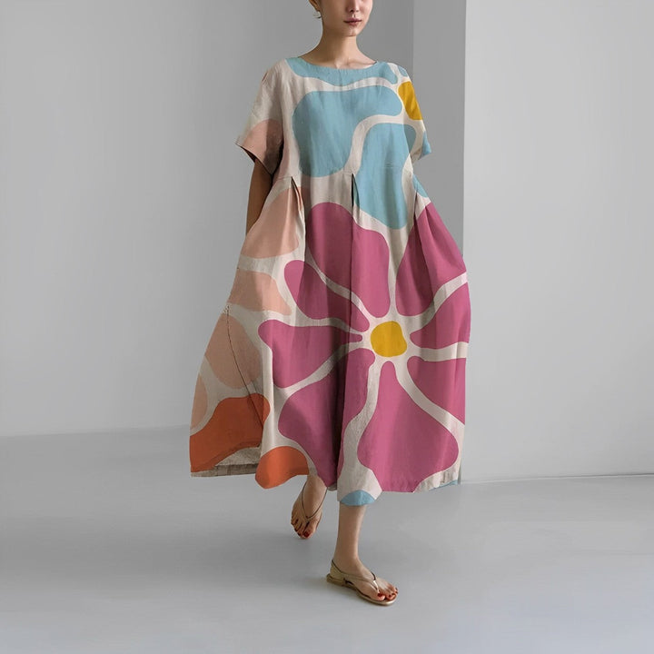 Flowy women's midi dress with artistic print, relaxed fit, ideal for casual wear, vacation, and summer fashion.