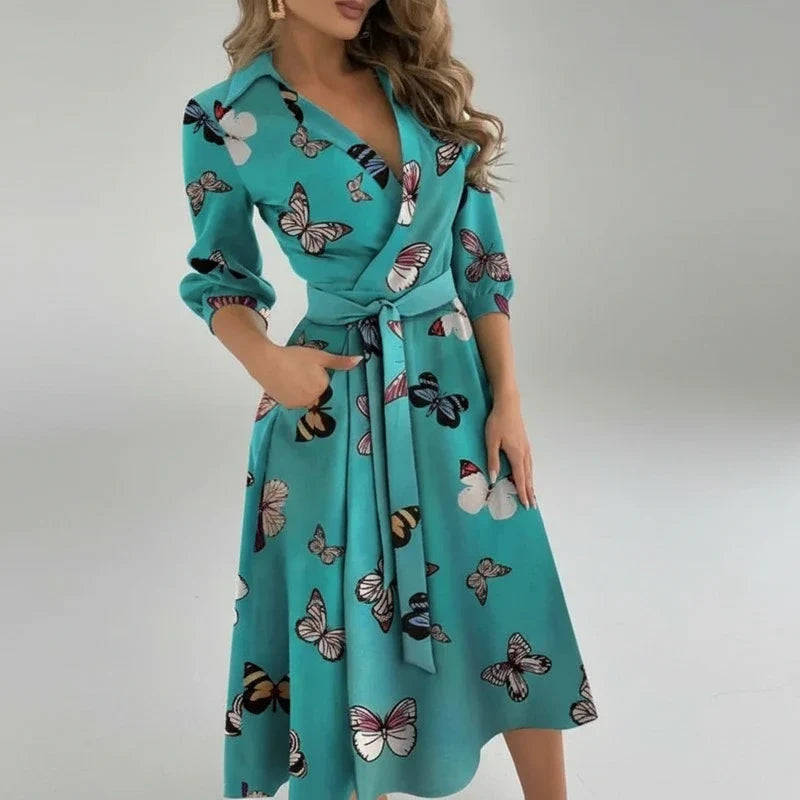 Casual women's 3/4 sleeve midi dress. Belted A-line design, V-neck. Versatile for work or summer days.